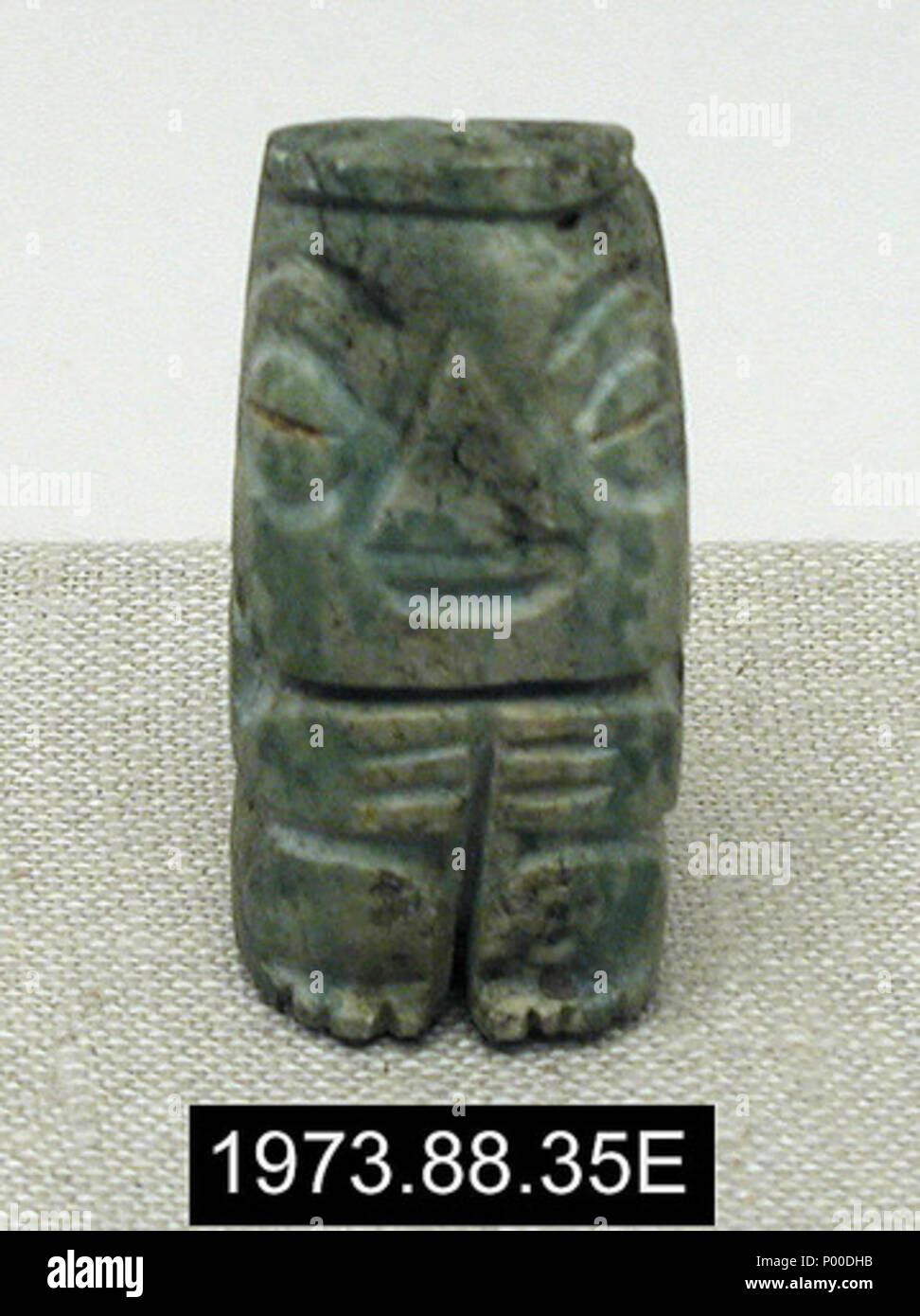 . English: A jade figurine (ca. 1200-1521) from the Late Postclassic Period in Mesoamerica. Measures 5.7 x 2.9 x 2.1 cm. From the collection of the Yale University Art Gallery.  . 5 December 1200. 'Acquisitions, 1973,” Yale University Art Gallery Bulletin 35, no. 1 (Summer 1974): 78. 53 Jade Figurine Stock Photo