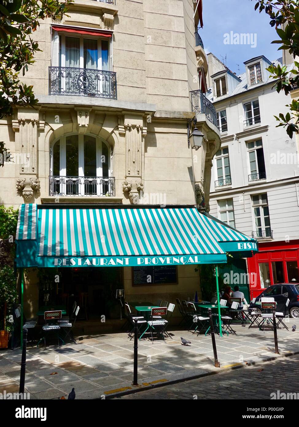 Almost empty outdoor terrace at Chez Janou restaurant in a shady corner of the Marais, Paris, France Stock Photo