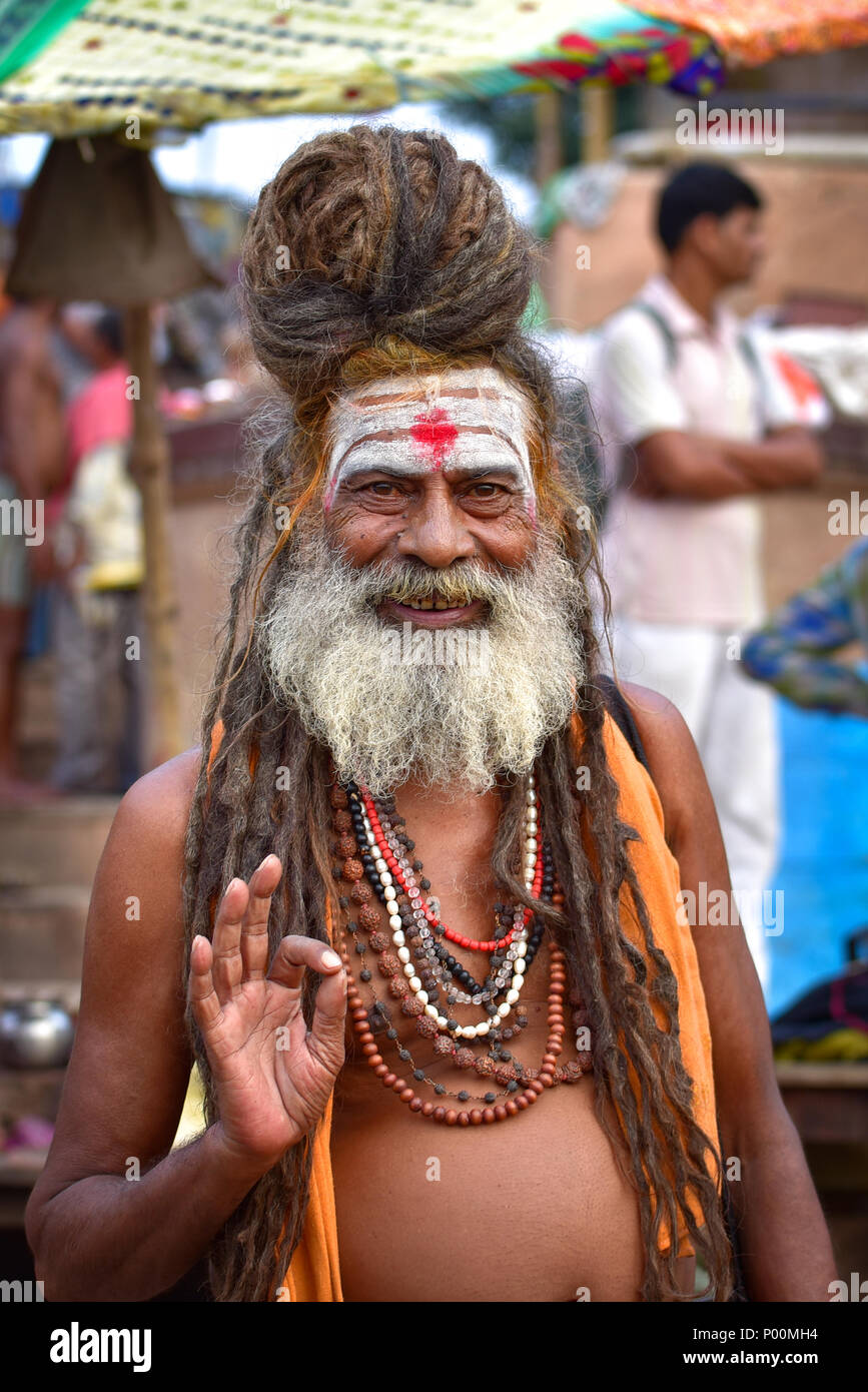 Portrait of a sadhu on ghat by Ganges river, Varanasi, India Stock Photo