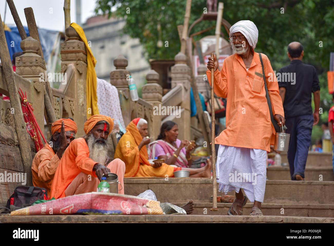 Hindu sadhu on ghat by Ganges river, Varanasi, India Stock Photo