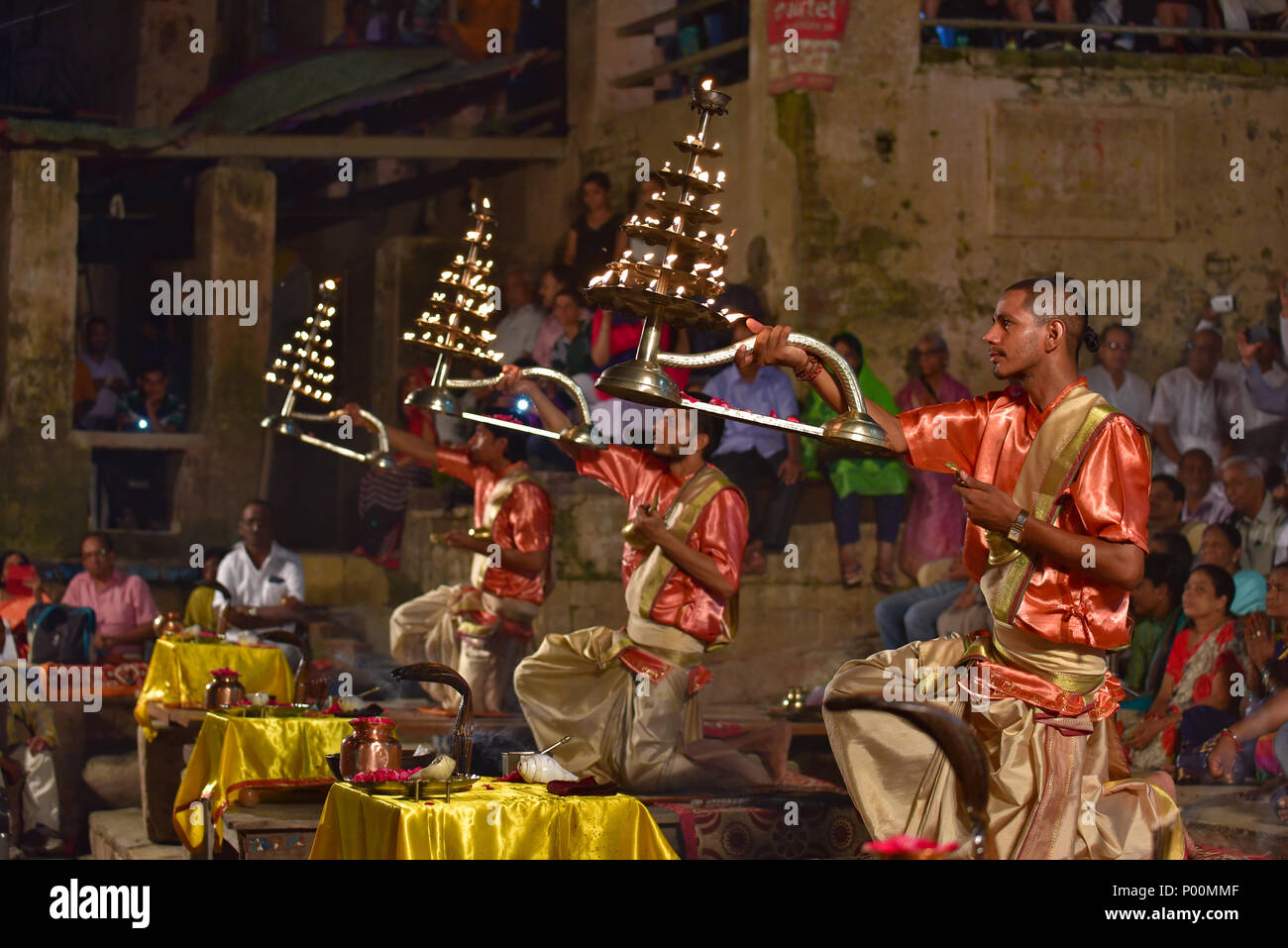Hindu priests performing evening Ganga Aarti ceremony, Dashashwamedh ghat, Varanasi Stock Photo