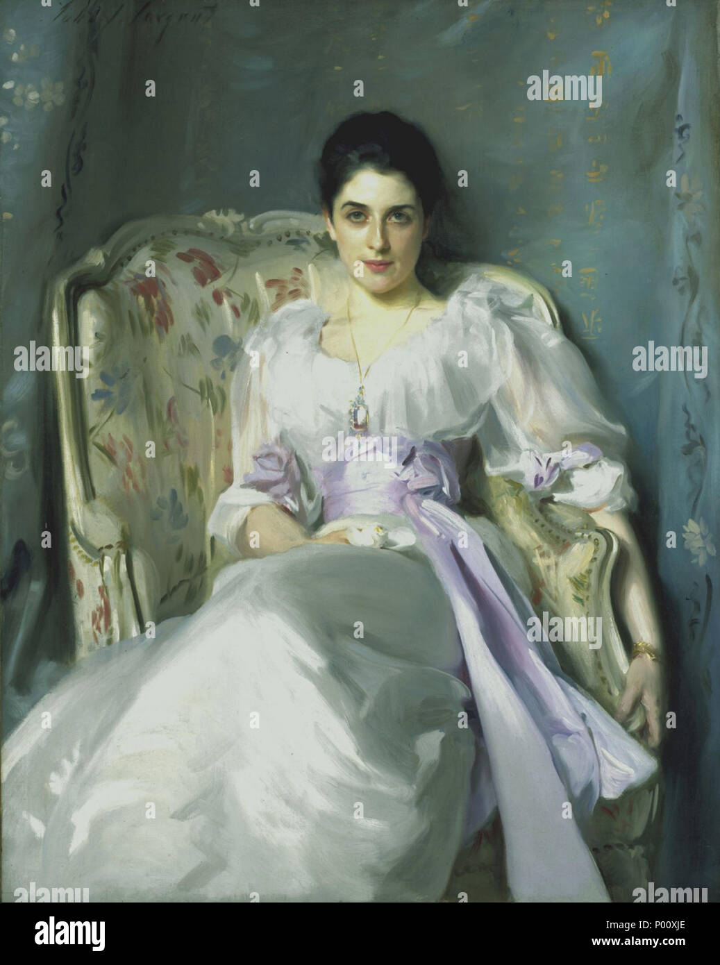.  English: Lady Agnew's direct gaze and informal pose, emphasised by the flowing fabric and lilac sash of her dress ensure the portrait's striking impact. Andrew Noel Agnew, a barrister who had inherited the baronetcy and estates of Lochnaw in Galloway, commissioned this painting of his young wife, Gertrude Vernon (1865-1932), in 1892. It was exhibited at the Royal Academy in 1898 and made Sargent's name. The sculptor Rodin described him as 'the Van Dyck of our times'. Portrait commissions poured in and Sargent enjoyed something of a cult following in Edwardian society. It also launched Lady  Stock Photo