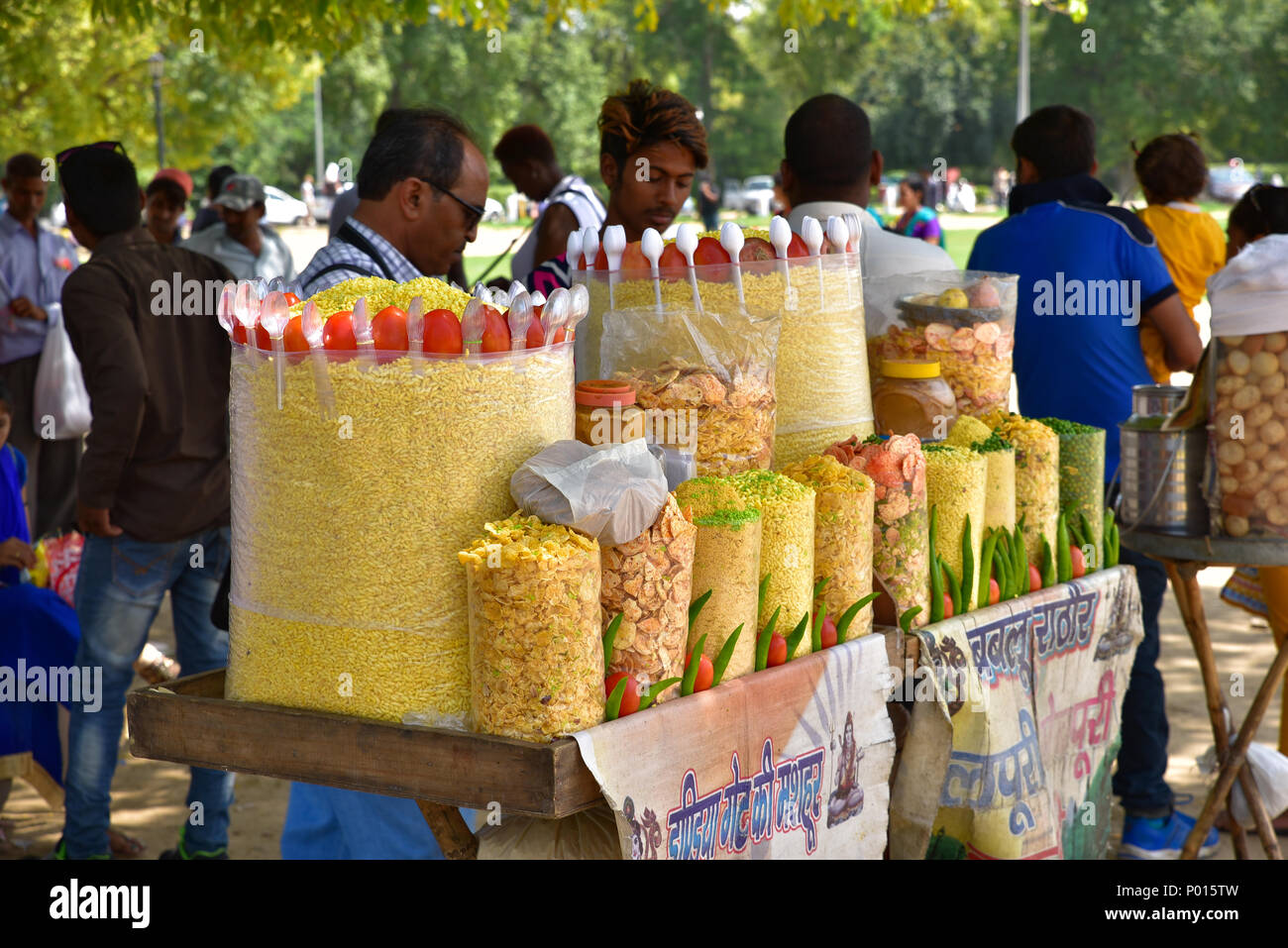 Street food vendor selling traditional snacks in New Delhi, India Stock Photo