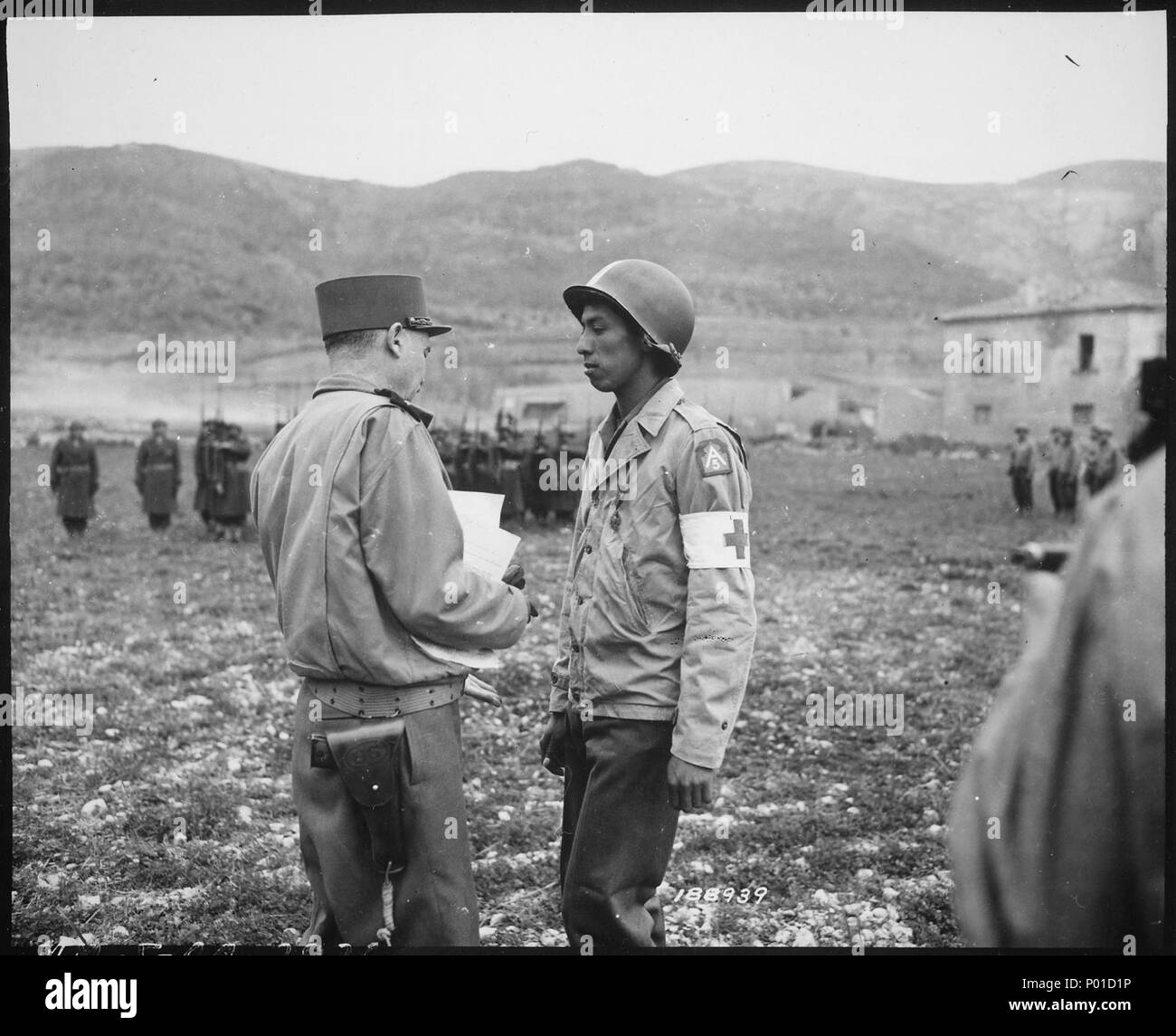 Pvt. Jonathan Hoag...of a chemical battalion, is awarded the Croix de Guerre by General Alphonse Juin, Commanding Gene - Stock Photo