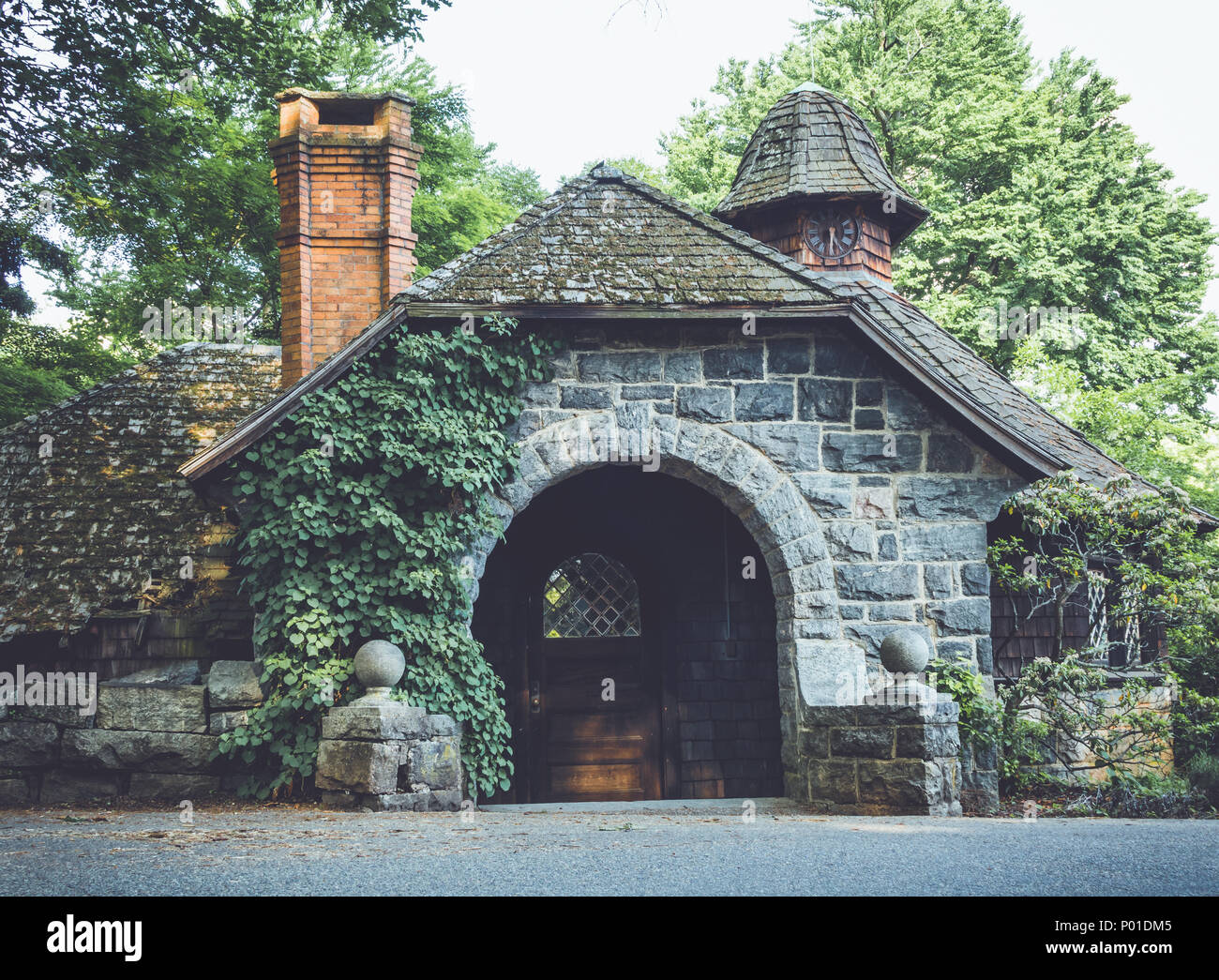 Old stone pumphouse in tudor revival architecture at Ringwood State Park, NJ in vintage setting Stock Photo