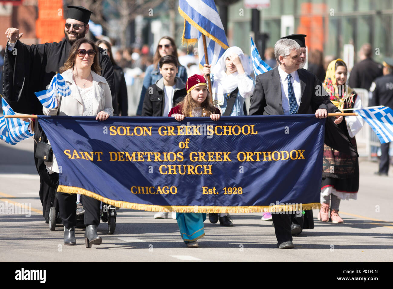 Chicago, Illinois, USA - April 29, 2018 Members of the Solon Greek School of Saint Demetrios Greek Orthodox Church wearing traditional clothing and wa Stock Photo
