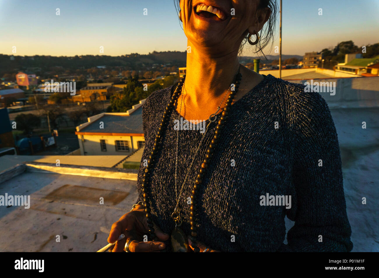 A woman with a marijuana cigarette in Johannesburg, South Africa Stock Photo