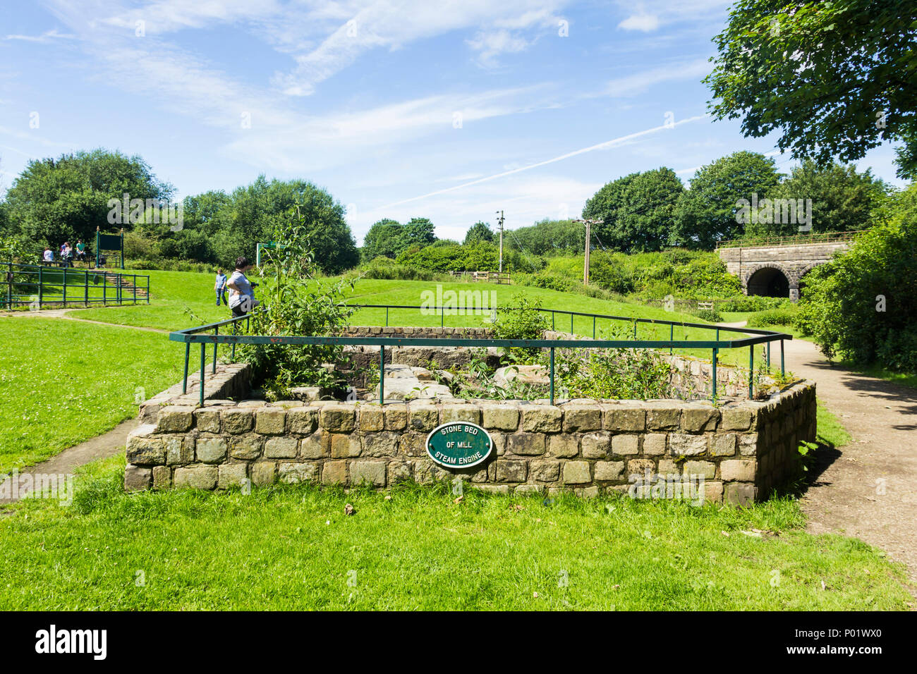 The stone base of the cotton mill steam engine at the former Burrs cotton mill, which now forms part of Burrs Country Park, Bury, Greater Manchester.  Stock Photo