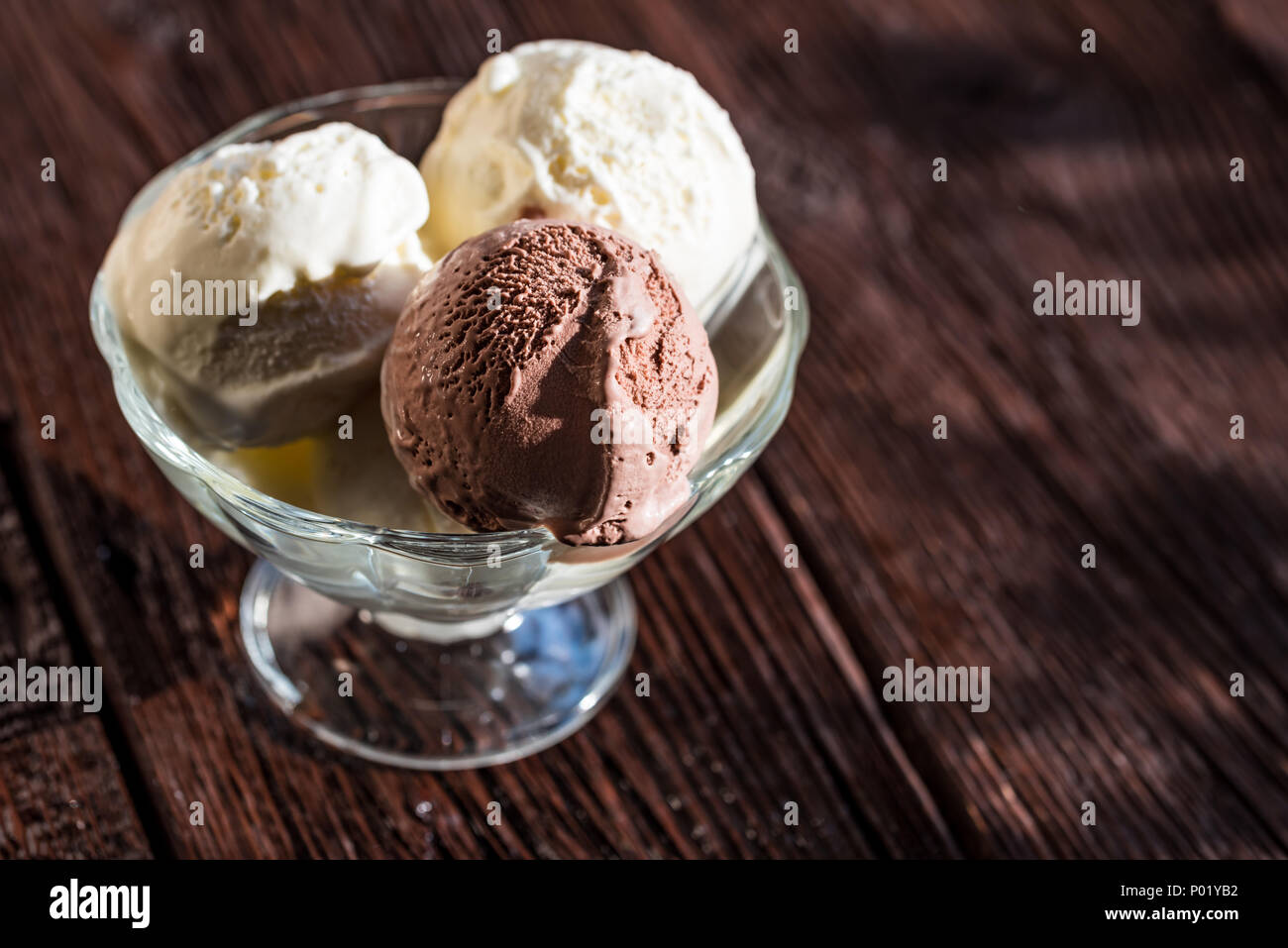 Delicious vanilla and chocolate ice cream in bowl Stock Photo - Alamy