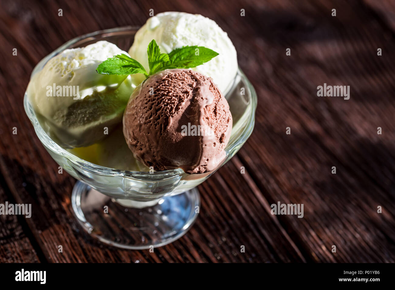 Delicious vanilla and chocolate ice cream in bowl Stock Photo - Alamy