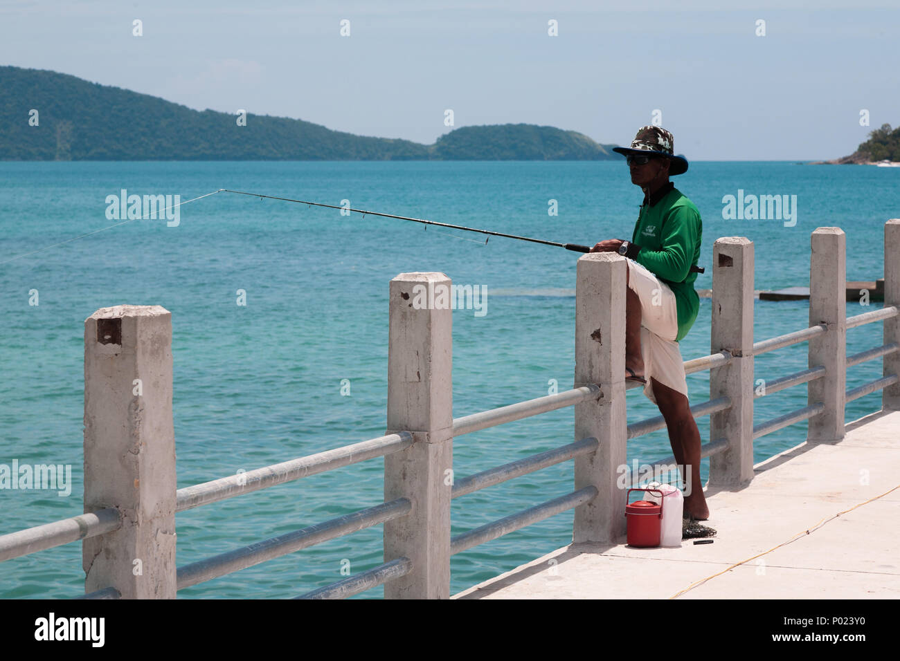 Man fishing in the blue ocean at Krabi Thailand, Asia. Stock Photo