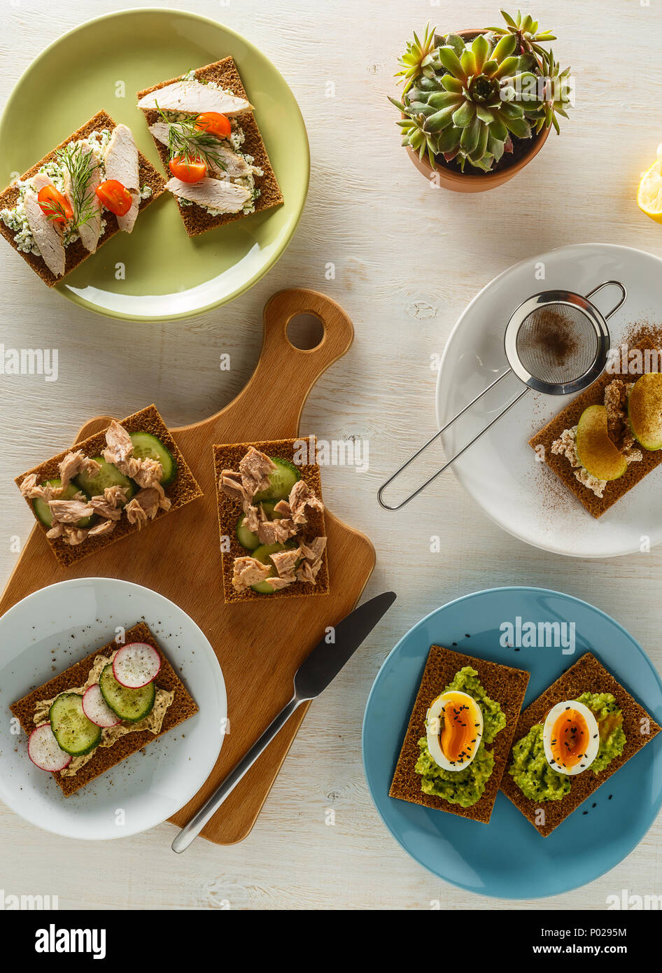 Healthy sandwiches with various fillings on crisp rye bread, top view