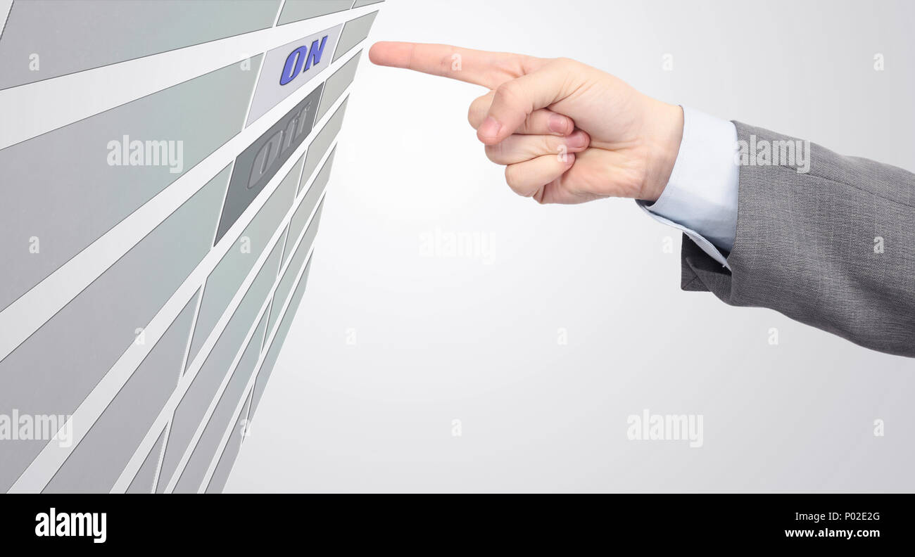 Human hand presses the power button Stock Photo - Alamy