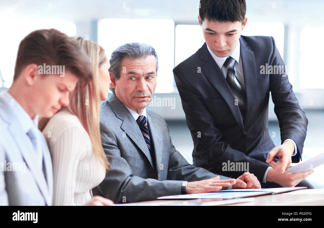 smiling business team discussing something Stock Photo