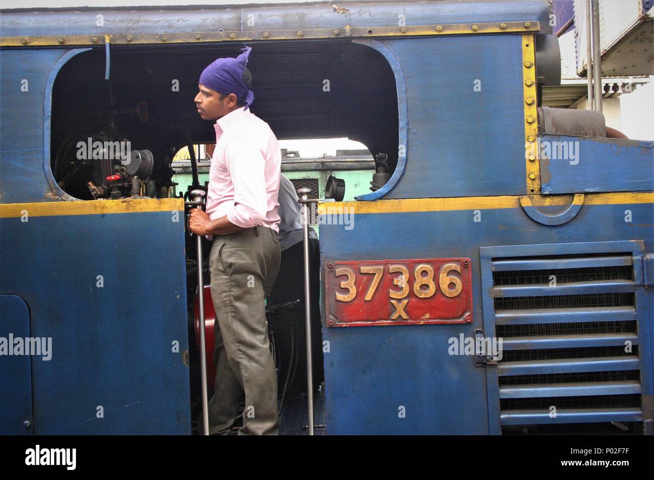 Train Driver on Footplate, Nilgiri Mountain Railway, Tamil Nadu, India