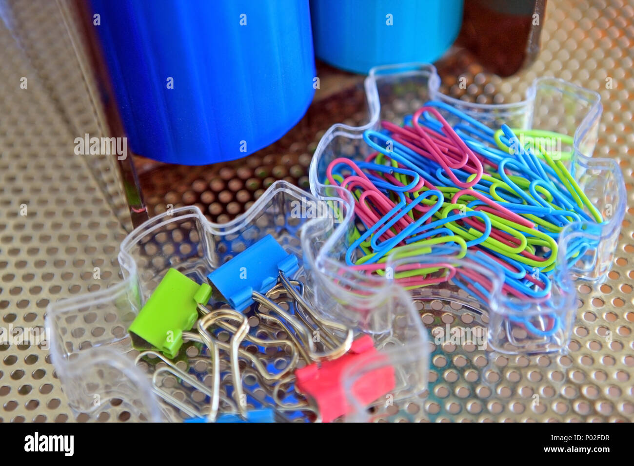 Paper clips and bulldog clips in plastic trays in a home office Stock Photo