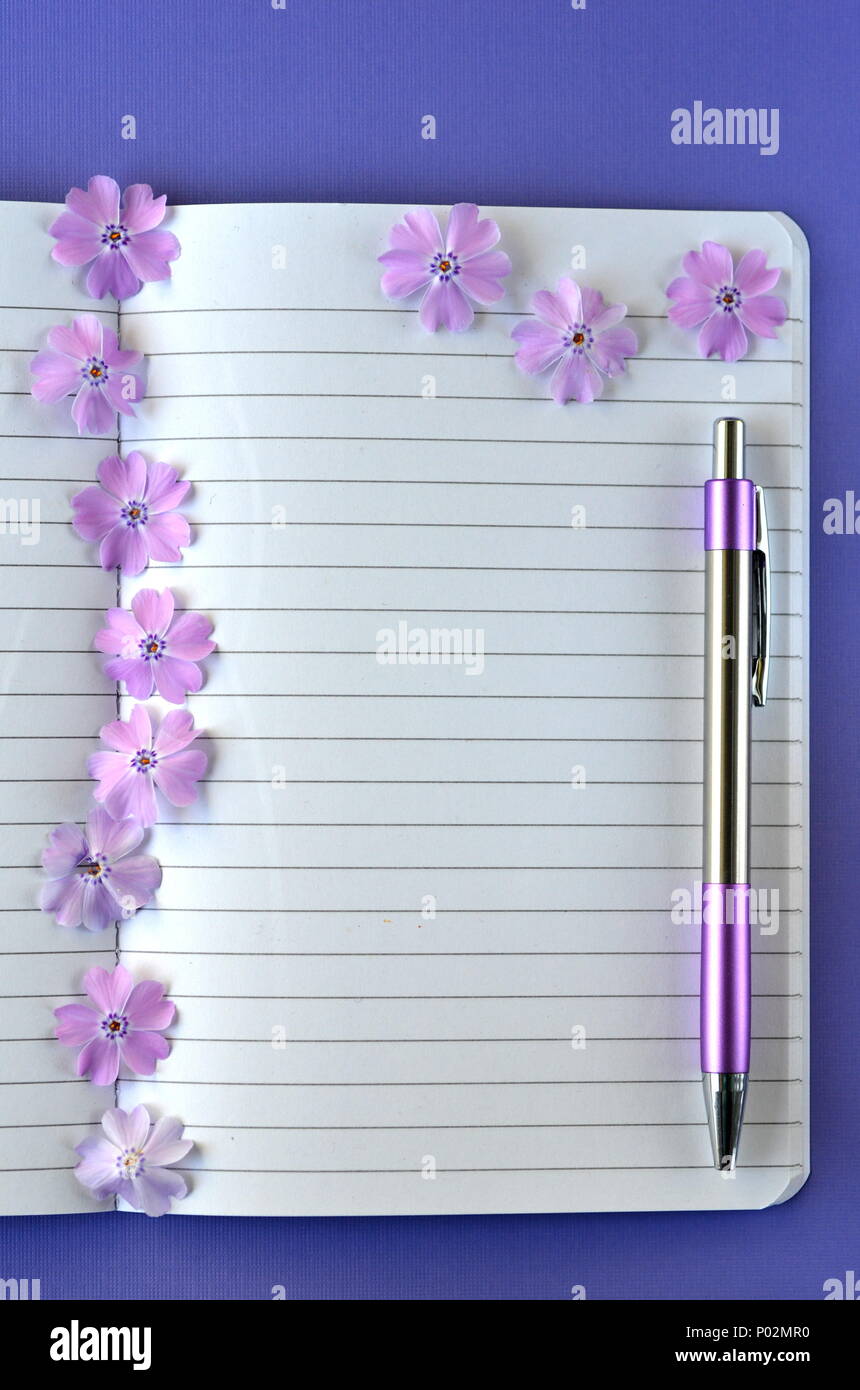 Ultra violet flatlay of feminine stationery, notebook, pen, lavender ...