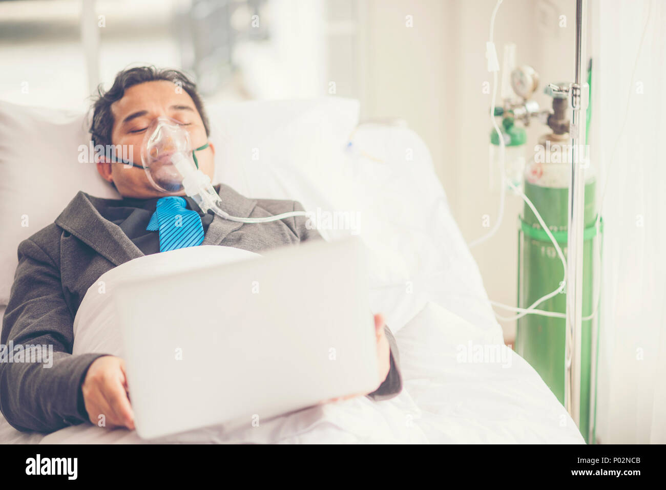 Sick Businessman are working on Hospital Bed, Work Hard Concept Stock Photo Alamy