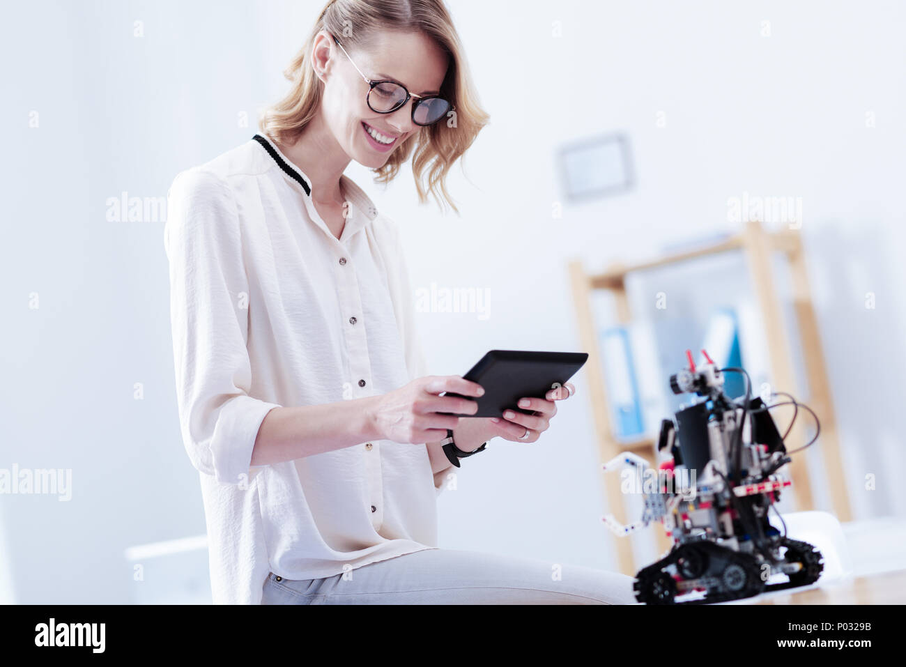 Happy nice woman using a tablet Stock Photo Alamy