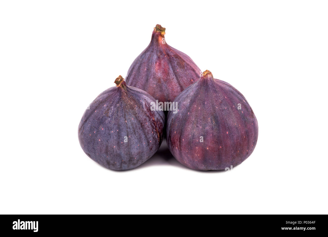 Three fresh and ripe figs isolated on white background Stock Photo
