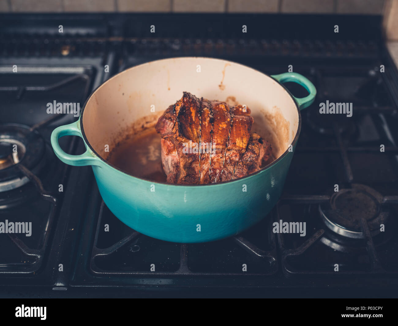 Delicious pork roast with crackling on the stove Stock Photo Alamy