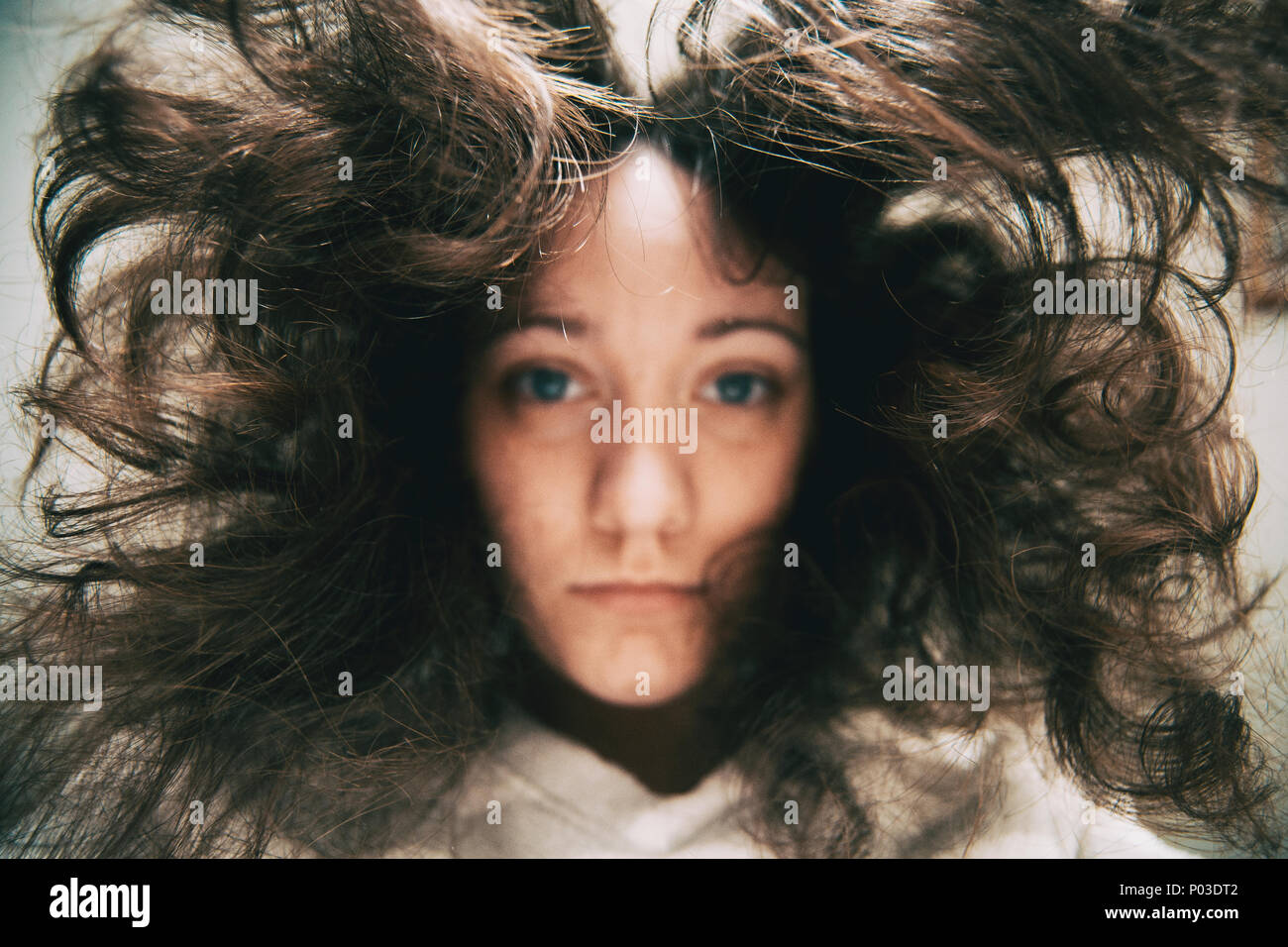 a girl looking at the camera face down Stock Photo Alamy
