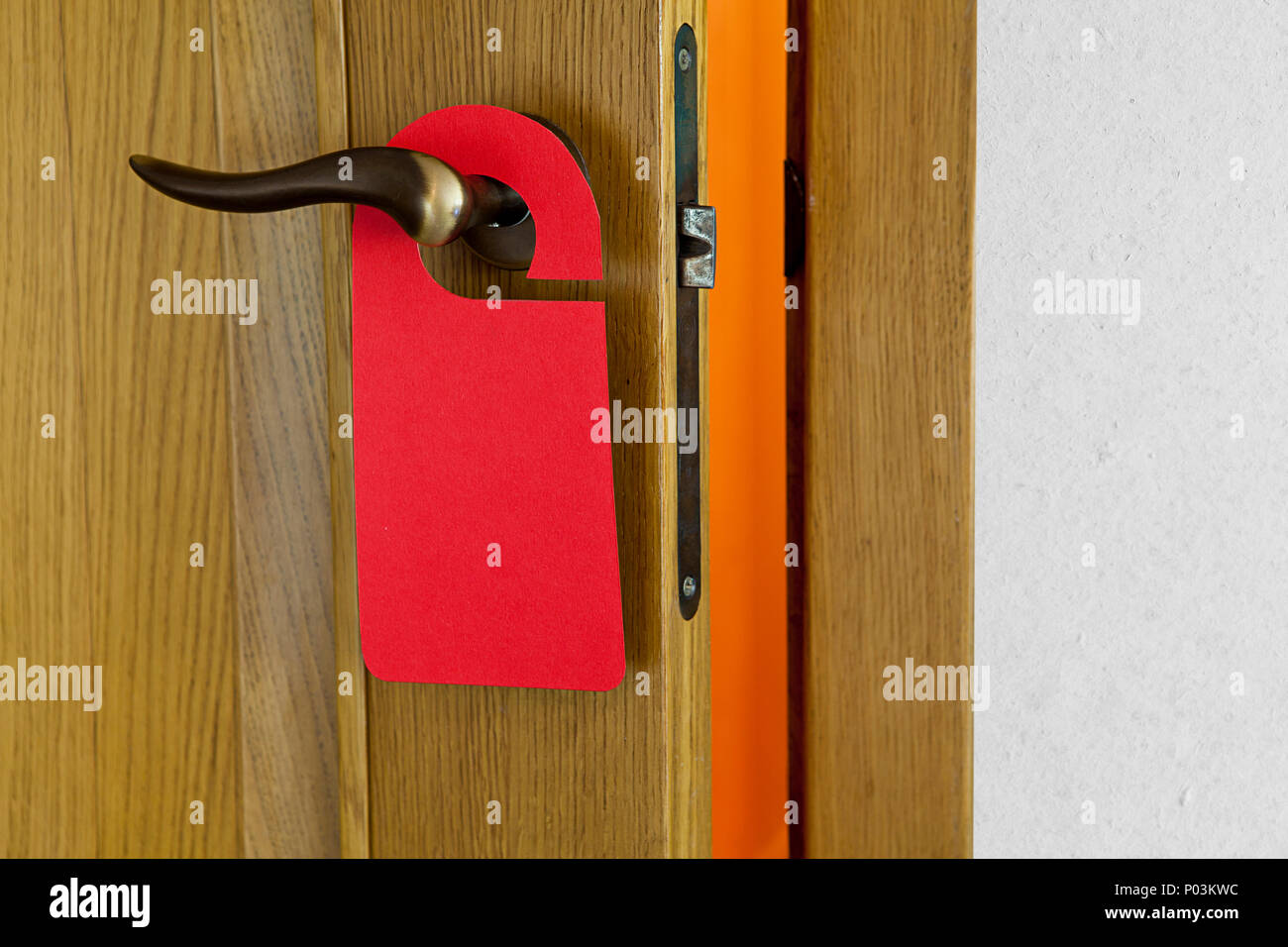 Hotel door handle with blank paper hanger Stock Photo - Alamy