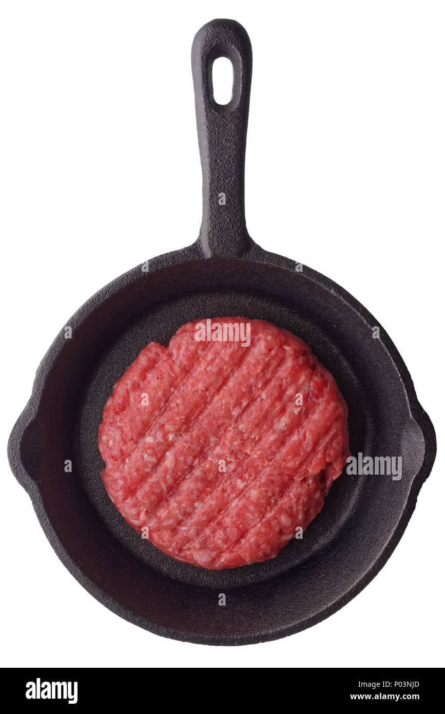 Food fresh uncooked homemade burger on a frying pan, isolated on white