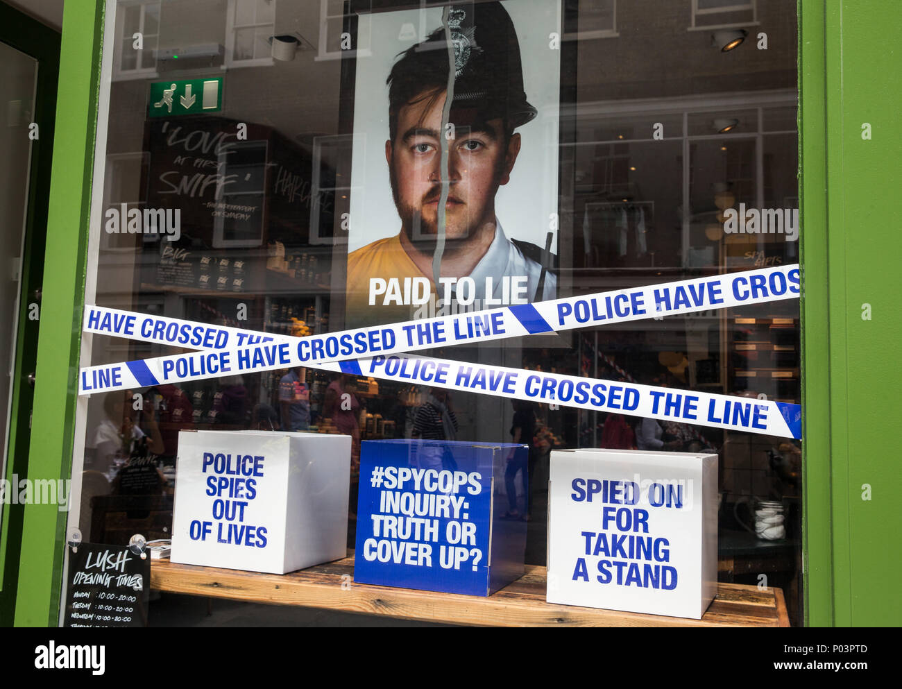 Cosmetic store, Lush,with its Spycops display in the window in Bond Street. It focussed on undercover police working to get information from activists. Stock Photo