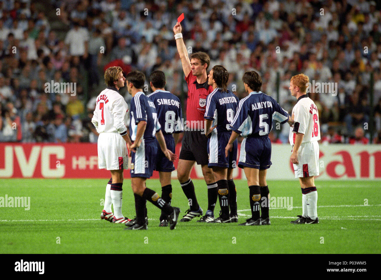 File photo dated 30-06-1998 of England's David Beckham (L) is given the red card by Danish referee Kim Milton Nielsen, after a foul on Argentina's Diego Simeone during their France '98 World Cup second round match held in St Etienne. argentina won the match 4-3 on penalties (2-2 after extra time). Stock Photo