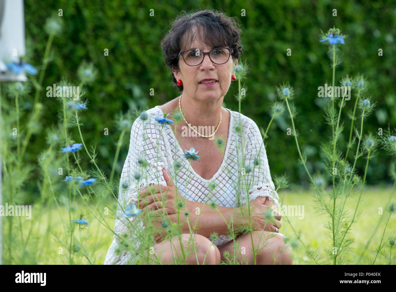 a portrait of a beautiful mature woman in the garden Stock Photo - Alamy