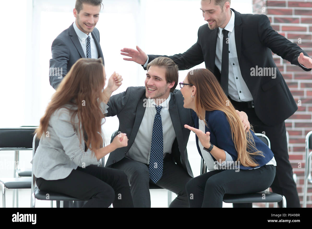 Hugging business people toasting to celebrate success Stock Photo - Alamy