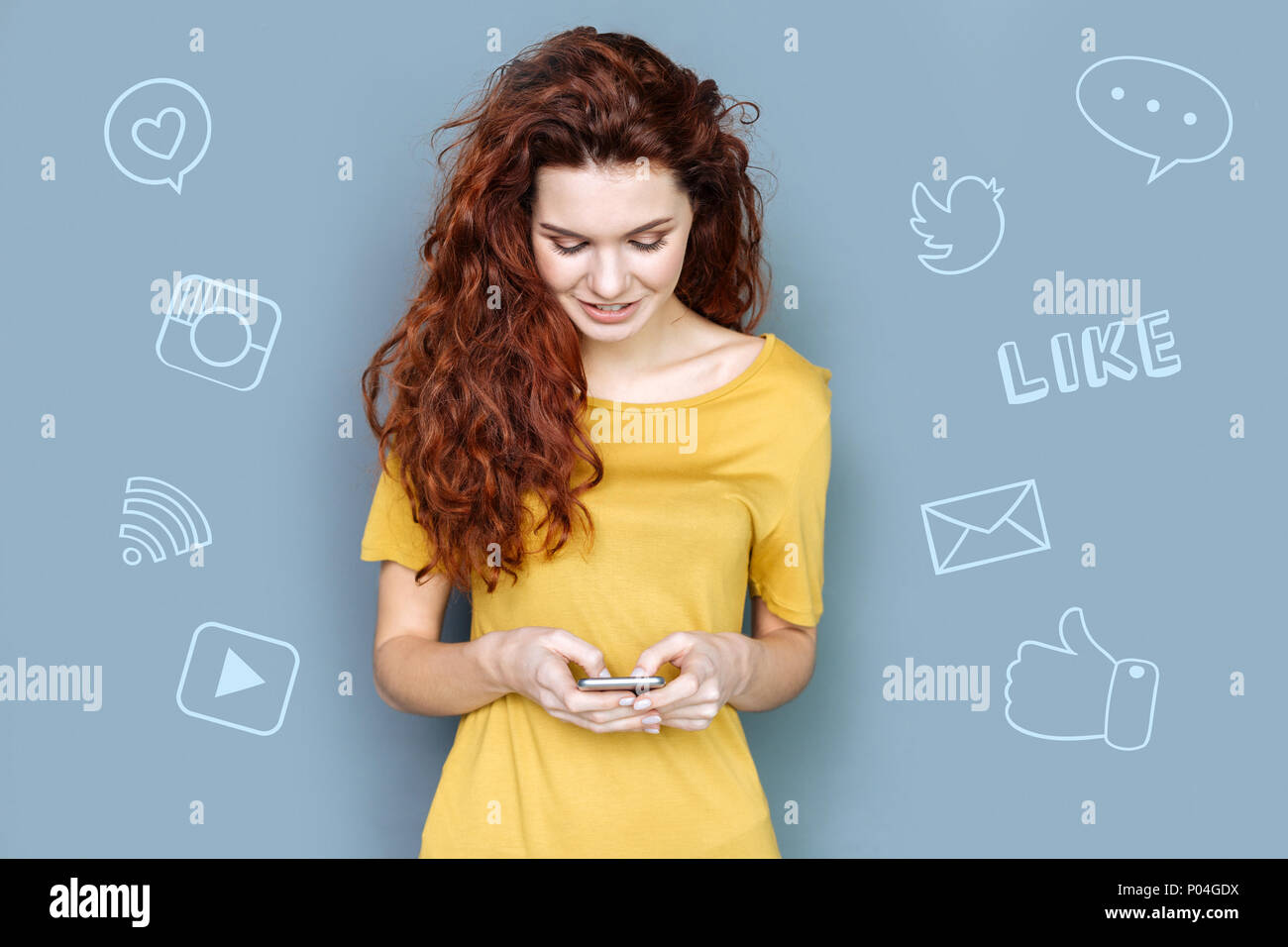Papular Bloger Popular blogger reading new comments to her video and smiling Stock ...