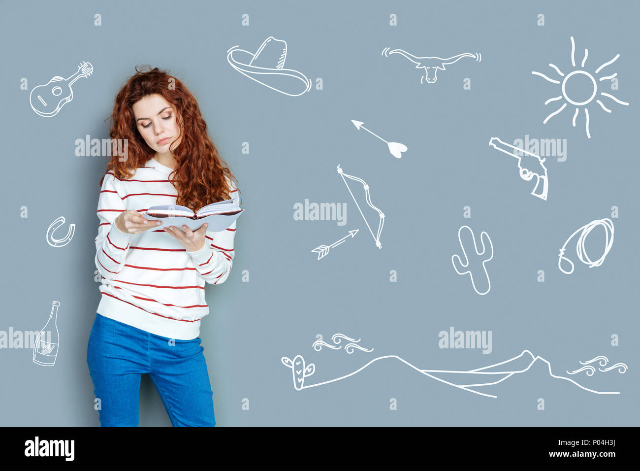 Relaxed teacher feeling good while reading adventure stories Stock ...