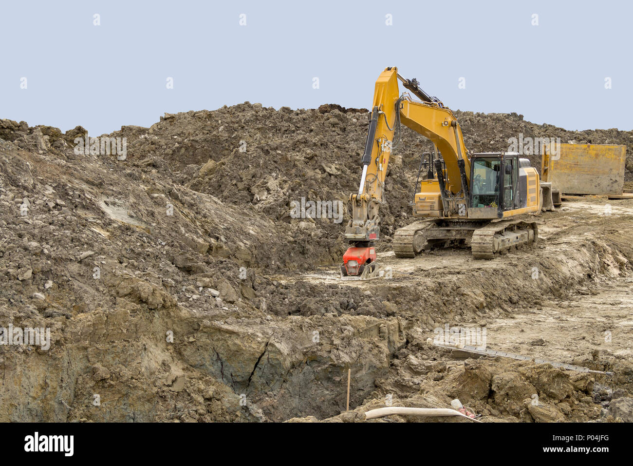 excavator at a loamy construction site Stock Photo - Alamy