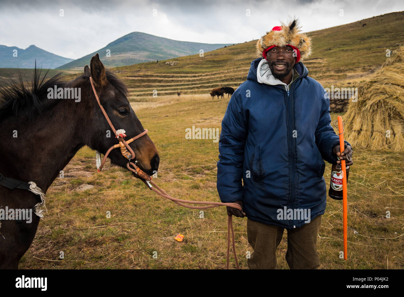 A Basotho man with his horse during a local horse racing event near Semonkong, Lesotho Stock Photo