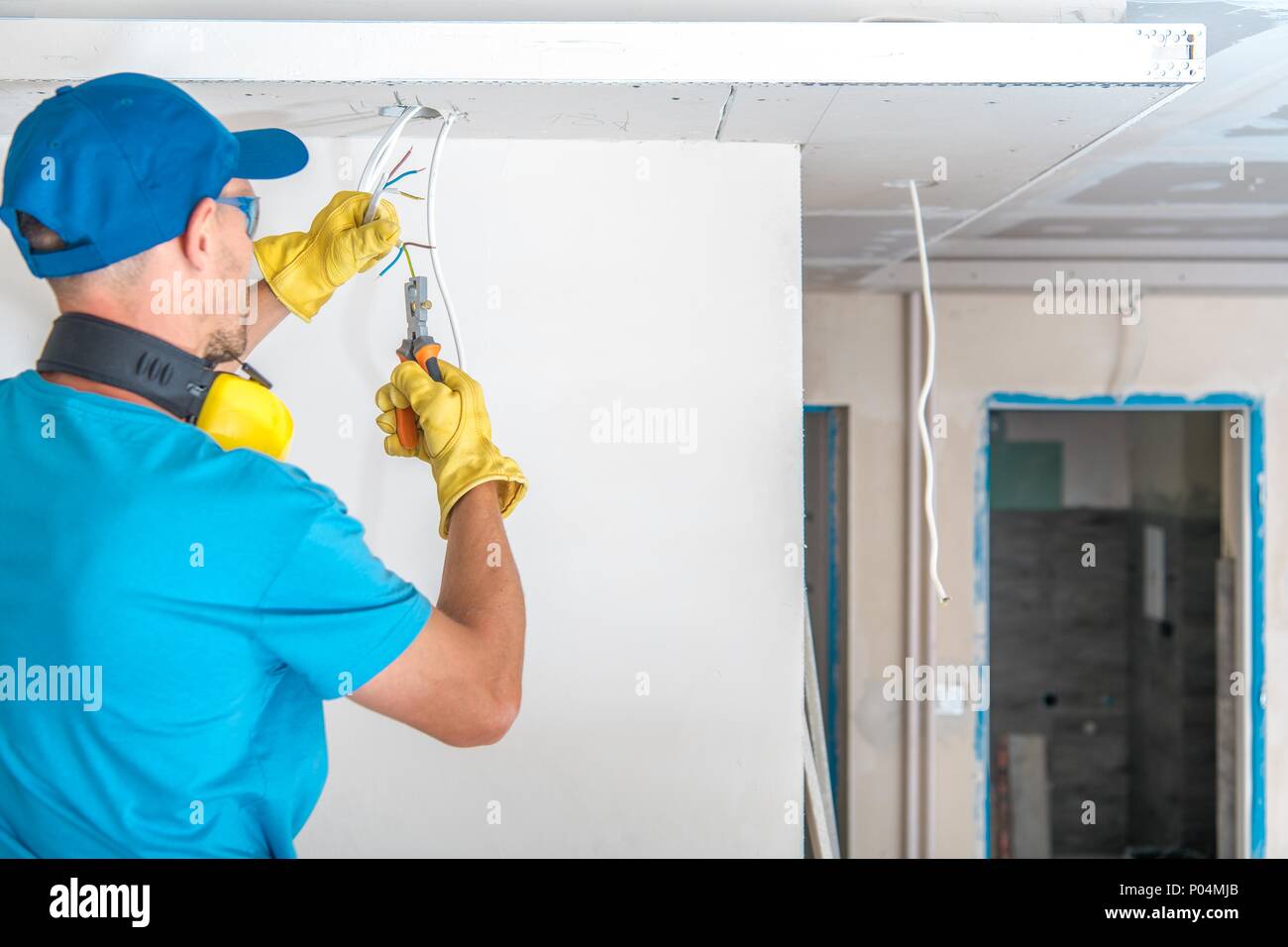 Electric Technician at Work Preparing Apartment Electric System Cables