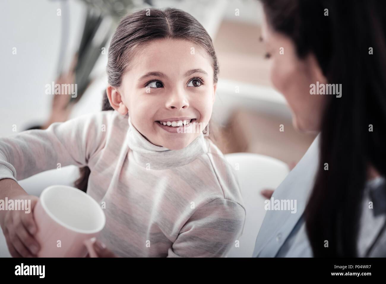 Portrait of delighted kid that holding cup Stock Photo