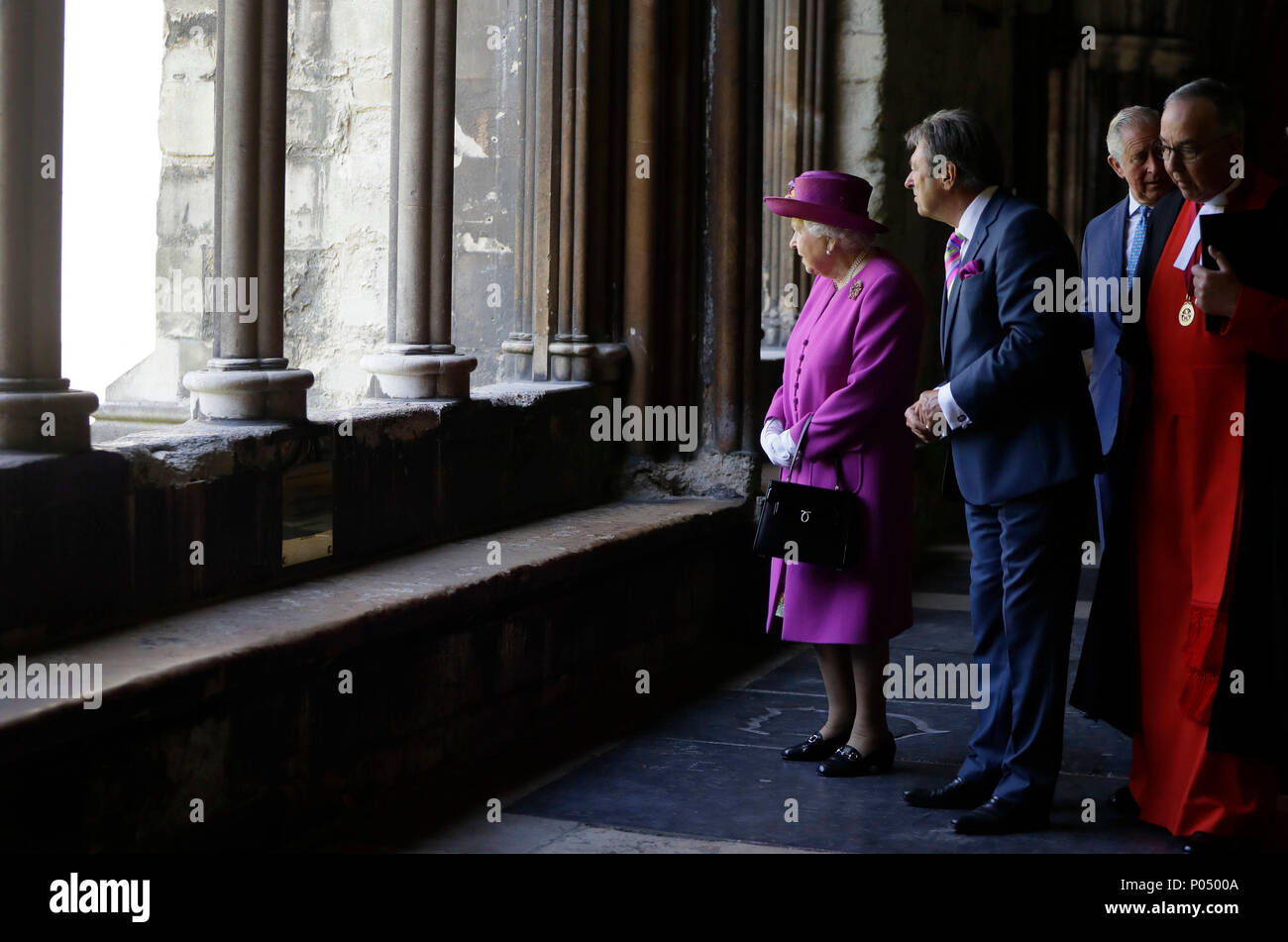 Queen Elizabeth II with celebrity gardener Alan Titchmarsh, walks through the cloisters after opening The Queen's Diamond Jubilee Galleries at Westminster Abbey in London. Stock Photo
