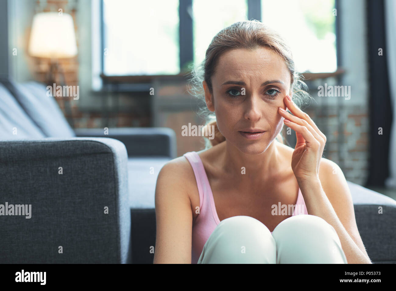 Miserable mature woman hurting face Stock Photo