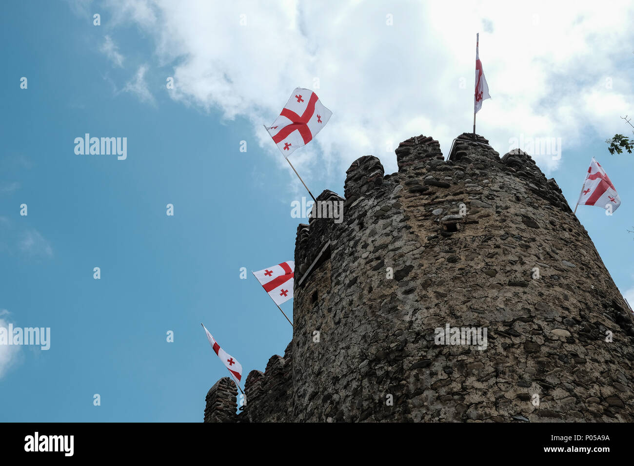 Georgian flags fly above the Castle of King Erekle II in Telavi, Georgia. Stock Photo