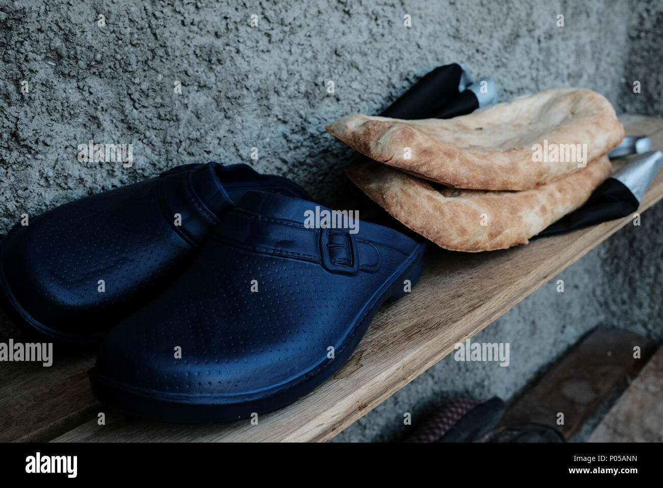 Bread and a pair of shoes share a shelf Stock Photo - Alamy