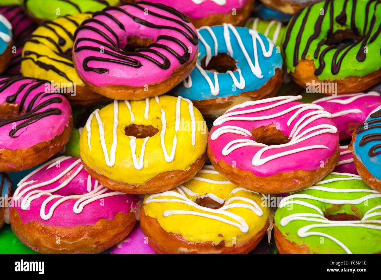 Download Many Colorful Donuts Background Of Different Color Cakes Stock Photo Alamy