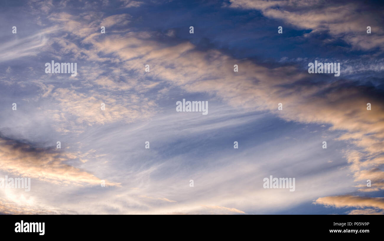 Mid and high clouds, cumulus clouds and stratus in a spring blue sky Stock Photo