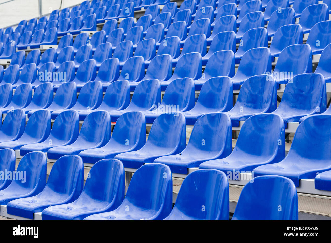 Blue seats at stadium Stock Photo Alamy