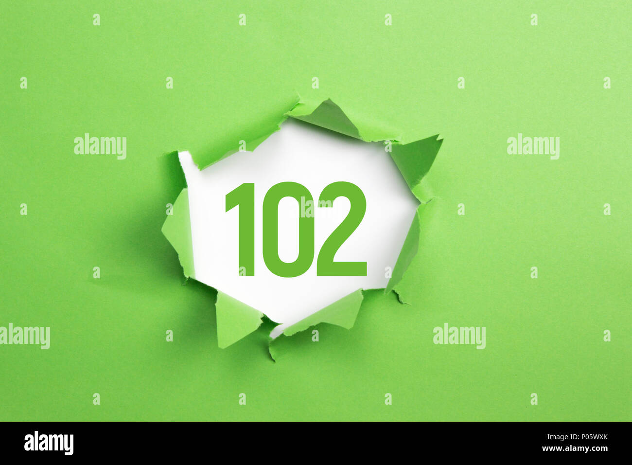 Green Number 158 on green paper background Stock Photo