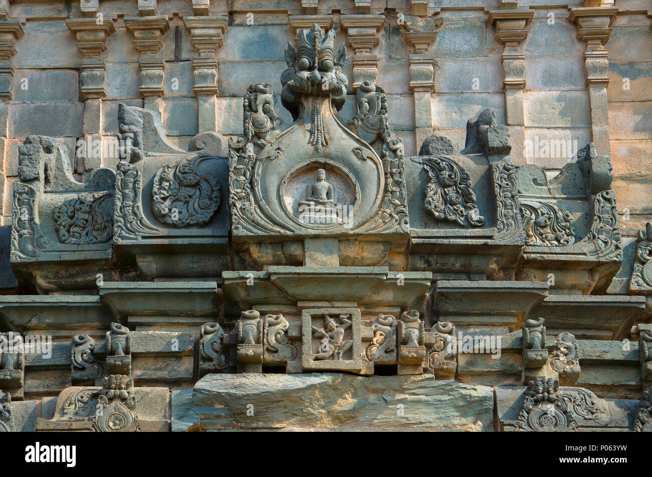 Carved idols on the outer wall of the Jain Temple, Lakkundi, Karnataka, India Stock Photo