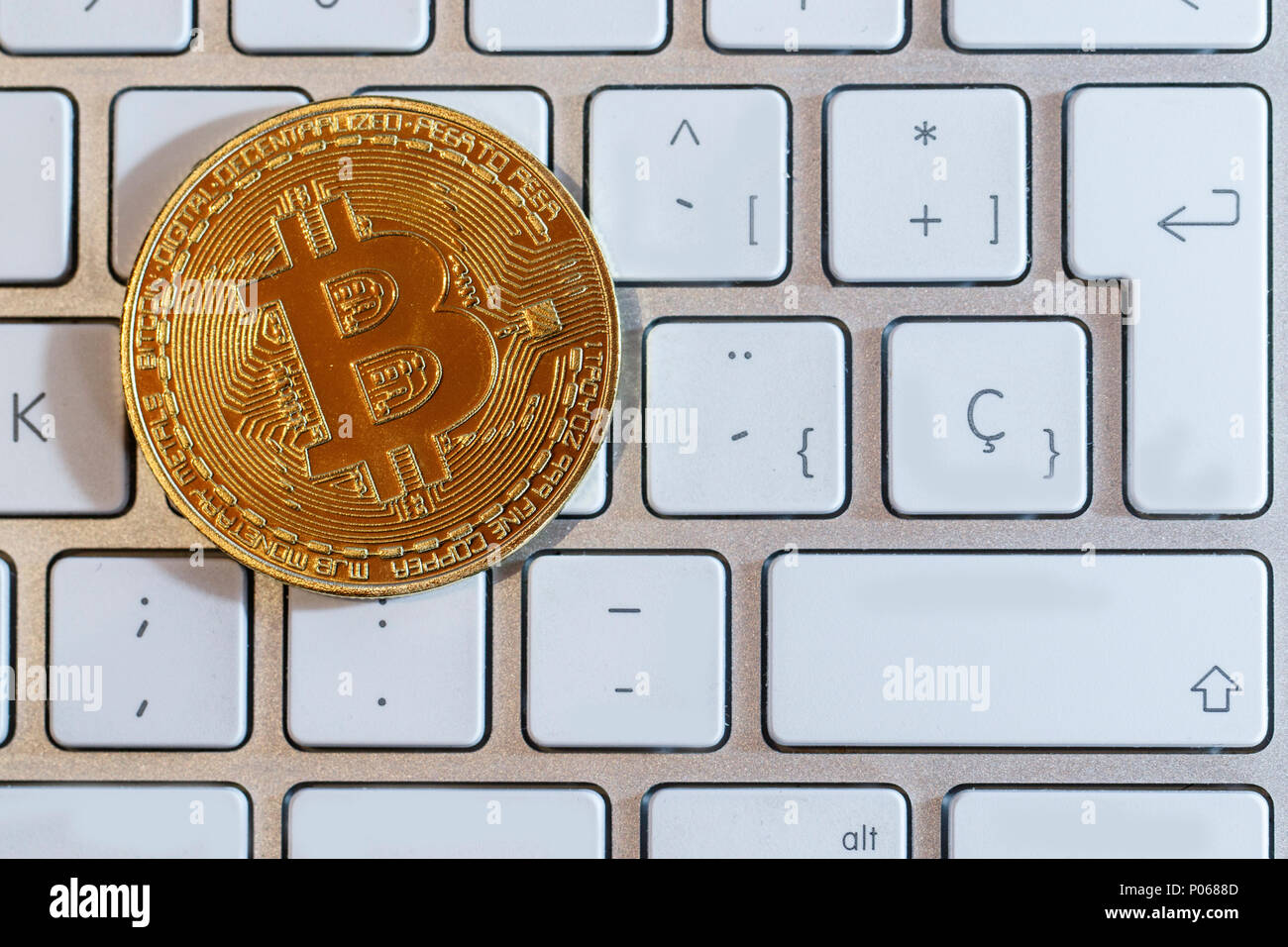 Concept image with physical coin of bitcoin crypto currency indicating of  price 9000 dollars for one bitcoin. Isolated white background Stock Photo -  Alamy