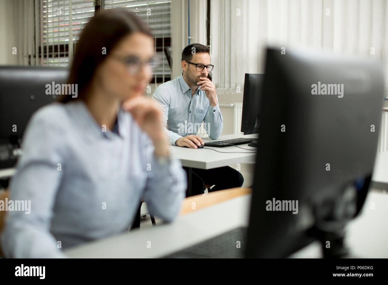Young couple learning in the classroom Stock Photo