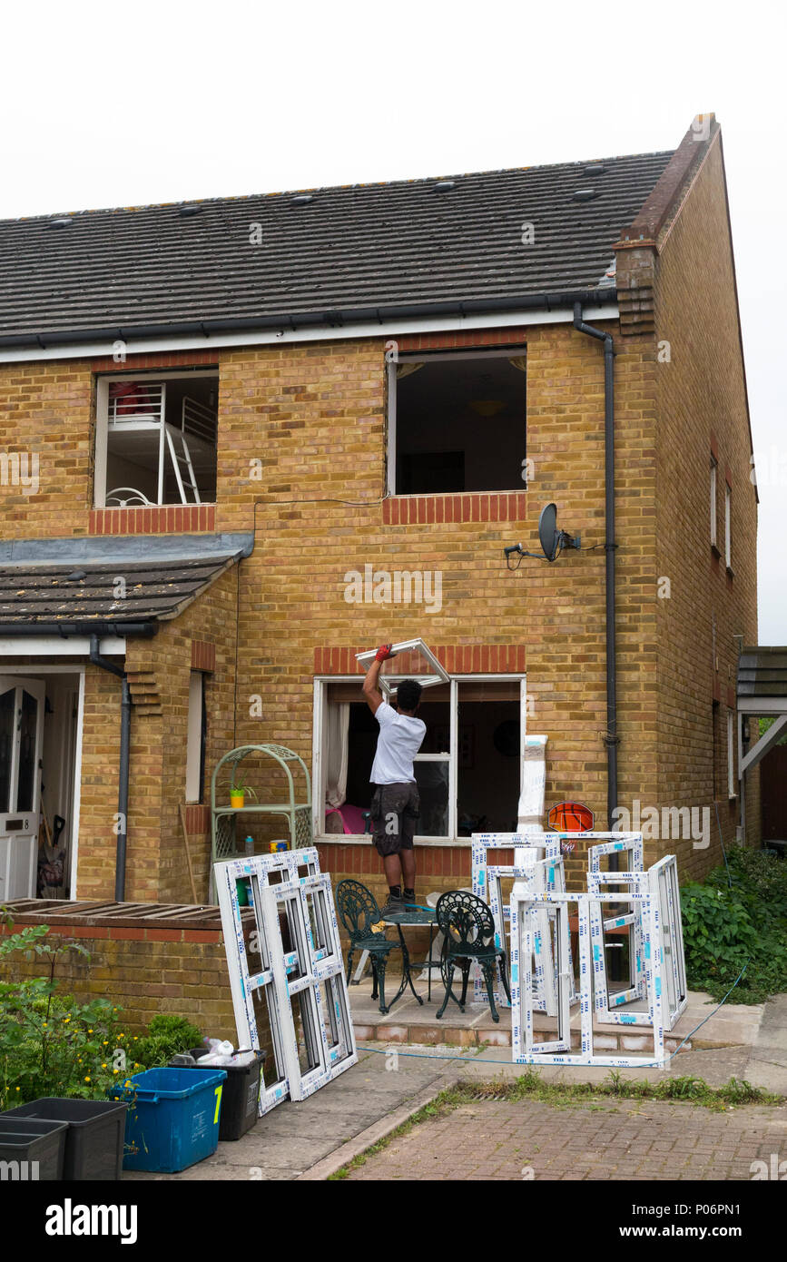 A Buy To Let Property Maisonette House Having New Replacement Upvc U Pvc Windows Fitted Installed And Old Wooden Window Removed Uk 99 Stock Photo Alamy